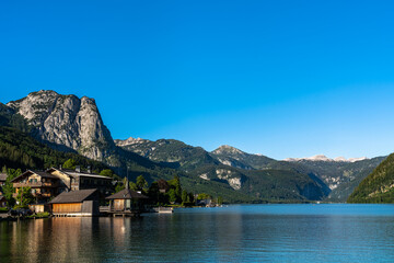 Stunning panorama view of Grundlsee lake with peaks of Styrian Alps in background on a sunny summer day, Styria, Austria - 517262276