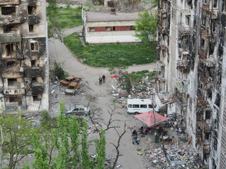War in Ukraine. The ruins of residential buildings burned down and destroyed by Russian troops in...