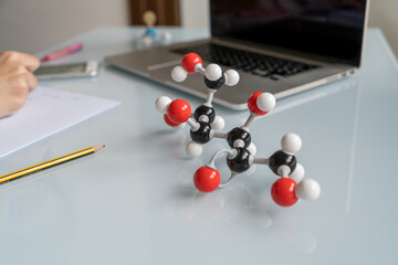 Close-up molecular model of fructose structure during chemistry class.