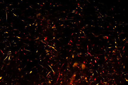 Fire Sparkles In Dark Blue Bokeh Background