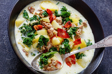 Zuppa Toscana,Tuscan Soup in black bowl, top view