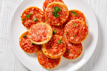 mini pizzas with ham and pecorino cheese, top view
