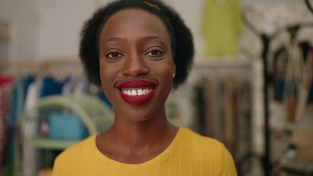 African american woman customer smiling confident standing at clothing store