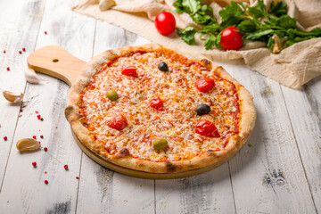 Italian pizza Margherita on white wooden table