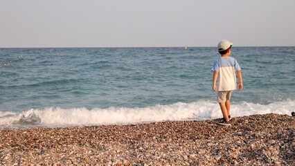 Preschooler walking on the seashore