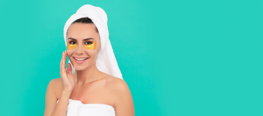 young woman in shower towel with collagen patch. Woman isolated face portrait, banner with copy...