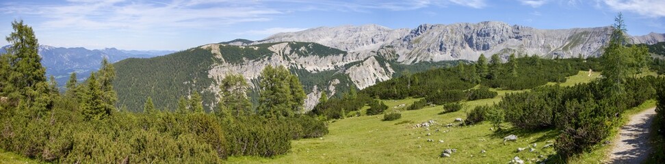 Panoramic view of the tourist path in Totes Gebirge (Alps) with a background of a ridge of Torstein and Pyhrner Kampl peaks, Austria