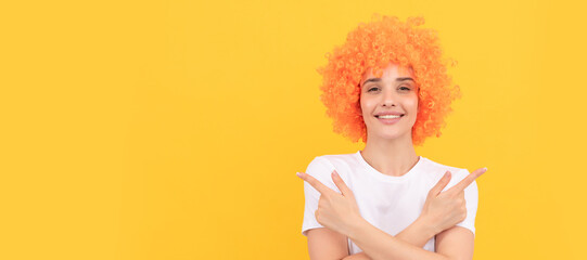 Woman isolated face portrait, banner with copy space. happy woman in curly wig. express positive...