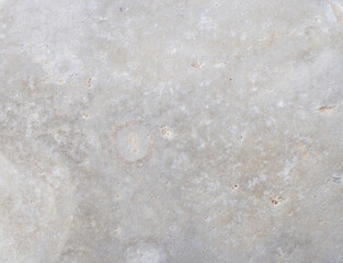Pattern from the surface of the stone. Cobblestone close up. The structure of a solid material.