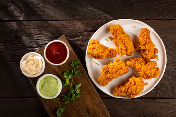 Crispy fried chicken with sauces.