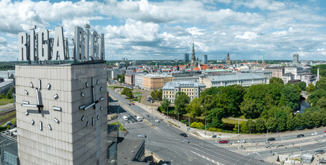 Riga, Latvia. July 10, 2022. Aerial view of the Riga central train station tower with name of the...