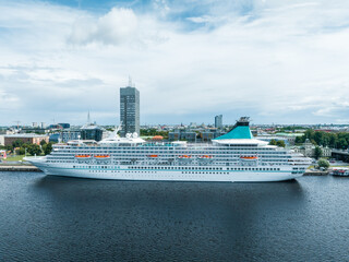 Beautiful cruise ship docked in Riga, Latvia near the old town and the bridge. Cruise in Latvia.