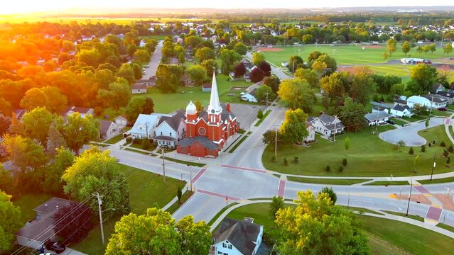 Sunrise flyover of scenic small town America.
