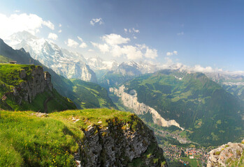 Fototapeta na wymiar Panorama of the Springtime View from Mannlichen Looking Down on the Lauterbrunnen Valley and the Cities of Wengen and Lauterbrunnen