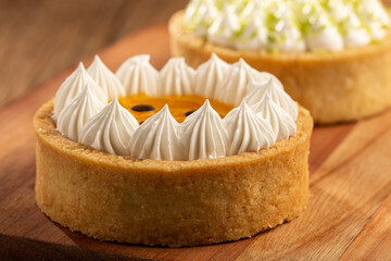 Tasty passion fruit tartlet on the table.