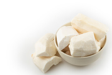 Peeled raw cassava isolated on white background.