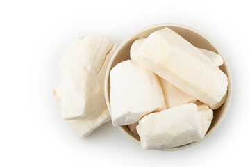Peeled raw cassava isolated on white background.