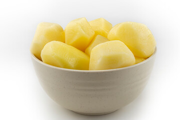 Peeled raw potatoes isolated on white background.