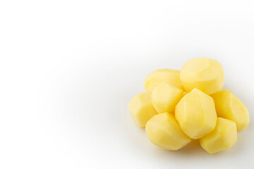 Peeled raw potatoes isolated on white background.