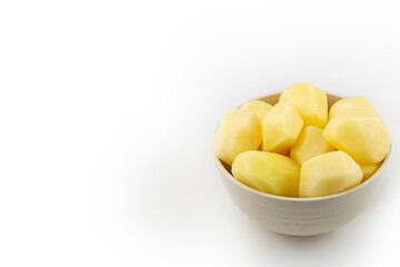 Peeled raw potatoes isolated on white background.