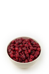 Diced raw beetroot isolated on white background.