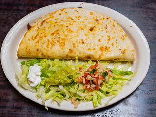 Close up shot of Mexician style beef taco with salad