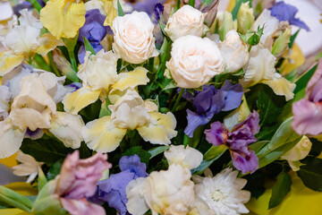 Beautiful freshly cut colorful bouquet. Irises. Flower delivery, flora shop concept. Selective focus.