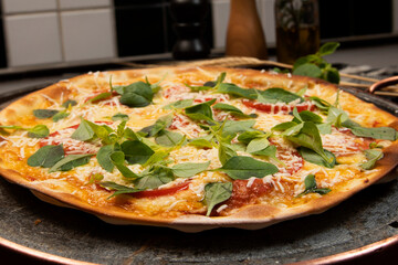 Brazilian pizza with pepperoni, cheese & arugula