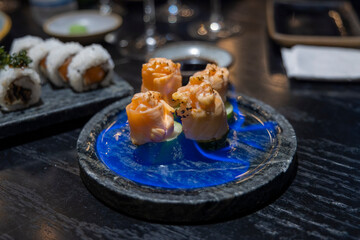 salmon sushi with blue flames, Novo Hamburgo, RS, Brazil