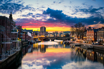 Naklejka premium The city of York in England with its Ouse river canal at sunset