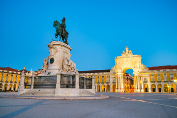 Commerce Square (Praca do Comercio) with Rua Augusta Arch and statue of of King Jose I at dawn in Lisbon. Portugal
