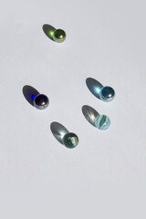 Clear glass bead reflect light on the white background.