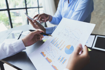 Business People Meeting to discuss and brainstorming the financial report paperwork in home office. Financial advisor teamwork and accounting concept.