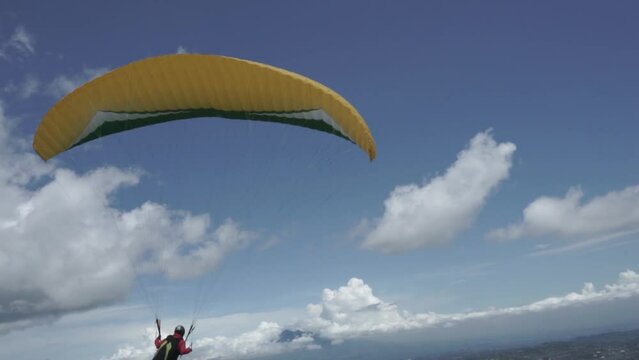 Paragliding Recreational Competitive Adventure Sport of Flying Paragliders from Hilltop in Puncak Cisarua Bogor, Indonesia