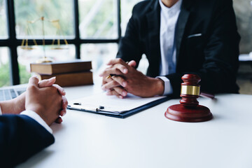 Consultation of Businesswoman and Male lawyer or judge counselor having team meeting with client, Law and Legal services concept.
