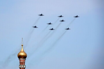 MIG-29SMT fighters fly in the sky over Red Square during the dress rehearsal of the parade...