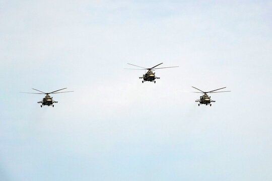 A group of multi-purpose Mi-8AMTSh helicopters in the sky over Moscow's Red Square during the dress rehearsal of the Victory Air Parade                              