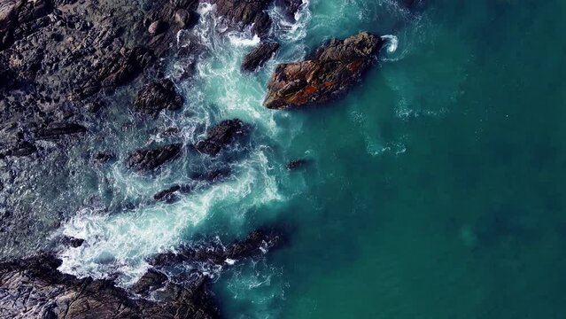 Top-down aerial view of rock beach deep blue ocean waves amazing and beautiful video Tropical Sea Andaman Sea Location Patong beach Phuket Thailand : 4K Video High quality Apple ProRes HQ