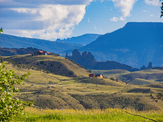 Obraz premium Sunny view of beautiful rural house on mountain
