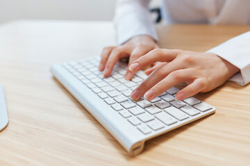 Closeup shot hands of businesswoman journalist office worker freelancer typing report doing documents on keyboard. Online communication, Remote job or Education. Copy space, wide angle