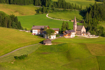 St Maddalena village with iconic church in Dolomites, northern Italy