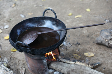 Indian traditional iron  frying pan with wood burning stove