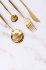 Clean golden metal cutlery