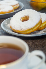 Donat kentang or potato donuts with a sprinkling of powdered sugar. donuts made of potatoes. have a sweet taste.has a soft texture