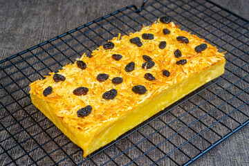 prol tape with cheese and raisin topping. traditional Indonesian food. made from cassava tape (fermented cassava).