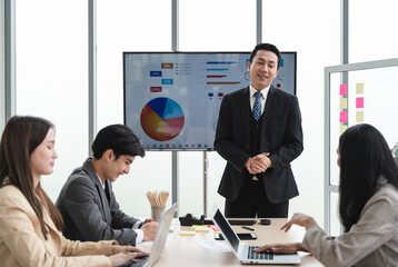 Office colleagues having casual discussion during meeting in conference room, Business and office concept, business team with laptop computers and documents