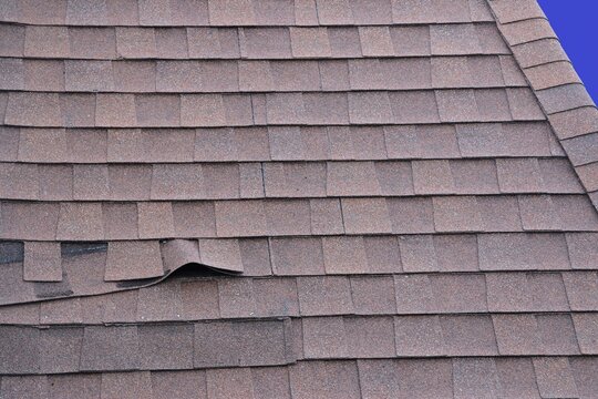 Shingles Peeling on Mansard Roof