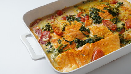 Salmon Fillet  with spinach and cherry tomatoes in creamy sauce