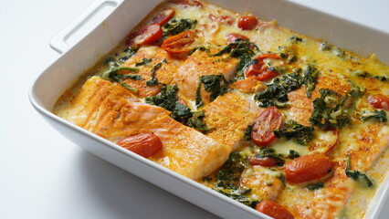 Salmon Fillet  with spinach and cherry tomatoes in creamy sauce