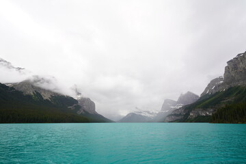 Shoreline of Maligne Lake, Jasper National Park, Alberta, Canada, on a rainy day - 517300848